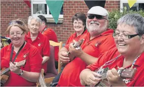  ??  ?? Play it again Members of the Neilston Strings Ukulele band were popular