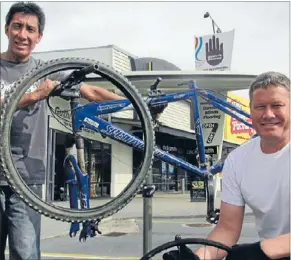  ??  ?? Messrs Fix-it: Mana Cycle Group president Rob MacIntyre and bike mechanic Daryl Young will fix bikes for free on Saturday.