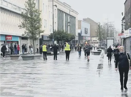  ??  ?? Shoppers out in High Street West yesterday.