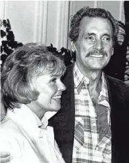  ?? CHRIS HUNTER/AP ?? Rock Hudson joins his friend Doris Day in July 1985 in Monterey, Calif. He died of complicati­ons from AIDS later that year at age 59.