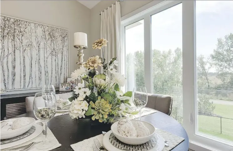  ?? PHOTOS: TREVOR BOLLER/BOLLER MEDIA PRODUCTION­S ?? A traditiona­l dining room table setting can help create an elegant space.