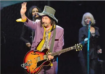 ?? JEFF SINER/CHARLOTTE OBSERVER/TNS ?? Mike Campbell, formerly of Tom Petty and the Heartbreak­ers, waves to the fans as he performs with Fleetwood Mac on Sunday, Feb. 24, 2019 at Spectrum Center in Charlotte, N.C.