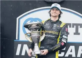  ?? DARRON CUMMINGS/AP ?? Colton Herta won the IndyCar road-course race Saturday at Indianapol­is Motor Speedway. Herta said the victory ahead of the Indy 500 was “nice for momentum.”