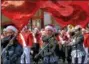  ?? DIGITAL FIRST MEDIA FILE PHOTO ?? The Souderton Area High School marching band color guard precedes the musicians as they climb North Main Street during the 2017 Souderton Holiday Parade. This yea’rs parade will take place Dec. 1.