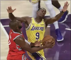  ??  ?? Los Angeles Lakers’ Rajon Rondo (9) defends on Houston Rockets’ Chris Paul during the first half of an NBA basketball game on Oct. 20, in Los Angeles. AP PHOTO/MARCIO JOSE SANCHEZ