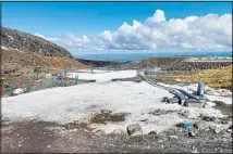  ?? ?? The learners’ slope is almost devoid of snow at the T roa ski field on Mt. Ruapehu, New Zealand on Sept. 21, 2022. Two of New Zealand’s largest ski areas on Tuesday, Oct. 11, were placed into a type of bankruptcy proceeding following a disastrous winter season with barely any snow. The T roa and Whakapapa ski areas, which are both owned by Ruapehu Alpine Lifts, entered what is called voluntary administra­tion. (AP)