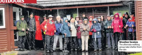  ??  ?? Weather beaten The alternate walking group take shelter from the rain