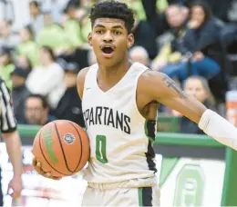  ?? ANDREW BURKE-STEVENSON/ DAILY SOUTHTOWN ?? Oak Lawn’s Corey Lee directs his teammates against Lemont during a South Suburban Conference crossover on Friday.