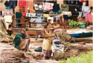  ?? AP PHOTO/THOKO CHIKONDI ?? Clothes are hung out to dry March 18 on power lines collapsed by last week’s heavy rains caused by Tropical Cyclone Freddy in Phalombe, southern Malawi.