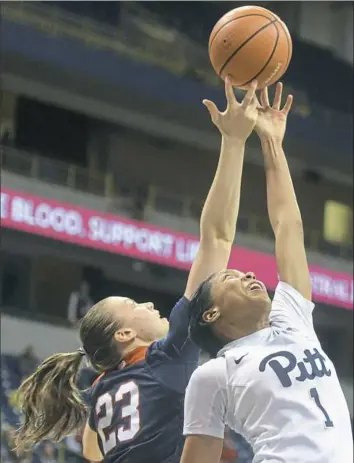  ?? Haley Nelson/Post-Gazette ?? Danielle Garven, right, of Pitt and Helmi Tulonen of Duquesne battle for the ball Thursday in the Dukes’ win at Petersen Events Center in Oakland.