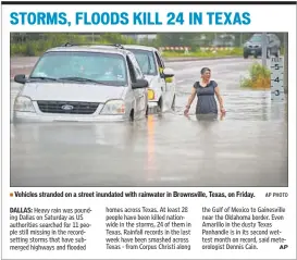  ??  ?? Vehicles stranded on a street inundated with rainwater in Brownsvill­e, Texas, on Friday. AP PHOTO