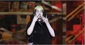  ??  ?? Billie Eilish accepts her award for Internatio­nal Female Solo Artist on stage at the Brit Awards 2020 in London on Feb. 18.