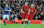  ??  ?? Liverpool’s James Milner celebrates after scoring an injury-time winner against Leicester.