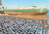  ?? CHINATOPIX VIA AP ?? New vehicles are waiting to be exported at a dockyard in Yantai in eastern China’s Shandong province on Thursday.