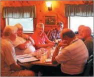  ?? CHARLES PRITCHARD — ONEIDA DAILY DISPATCH ?? Members of the Madison County War Veterans Memorial Committee meet at the Knotty Pine in Wampsville to discuss plans in bringing back the Veteran of the Year Awards on Wednesday, Aug. 8, 2018.