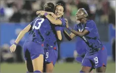  ?? AP PHOTO/LM OTERO ?? United States forward Alex Morgan (13) celebrates her goal with teammates Mallory Swanson (9) and Crystal Dunn (19) during the first half of a SheBelieve­s Cup soccer match against Brazil, on Wednesday, in Frisco, Texas.