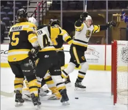  ?? JOHN RENNISON, THE HAMILTON SPECTATOR ?? Bulldogs’ Matthew Strombe, back right, celebrates his first period goal against the Kingston Frontenacs Saturday night in a 7-4 win. The team lost 7-3 Sunday to Niagara.