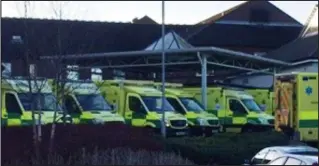  ??  ?? Struggling: Ambulances – not all of them visible – queue at Wrexham Maelor