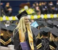  ?? RICK KAUFFMAN — DIGITAL FIRST MEDIA ?? Ruby Valadez-Bonilla, originally from California, smiles after receiving her associates degree in sociology from DCCC.