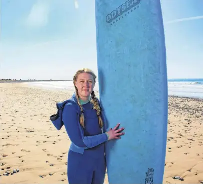  ?? RYAN TAPLIN ■ THE CHRONICLE HERALD ?? Surfer Shelby Miller poses for a photo at Conrad's Beach on Thursday, April 21, 2022.