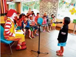  ??  ?? The audience captivated by the young storytelle­r’s gripping tale.