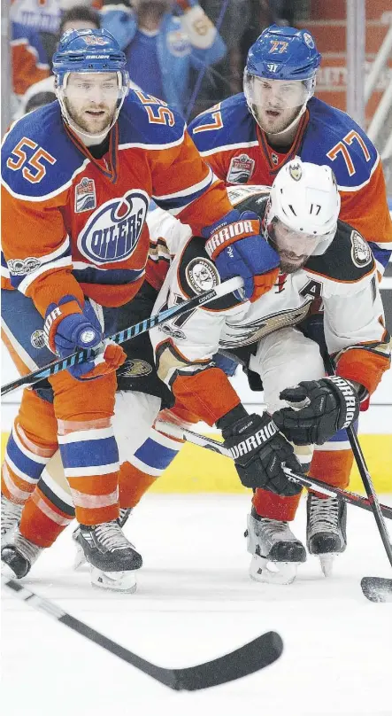  ?? CODIE MCLACHLAN/GETTY IMAGES FILES ?? Mark Letestu, left, and Oscar Klefbom put the squeeze on Ducks forward Ryan Kesler. Both Letestu and Klefbom played prominent roles in the Oilers’ success this season.