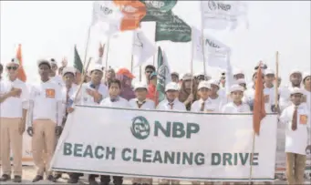  ?? KARACHI
-APP ?? National Bank of Pakistan managment along with school children organise a beach cleaning drive at Sea View.