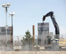  ?? REUTERS ?? AN APRIL 2 PHOTO taken from Ciudad Juarez, Mexico shows heavy machinery at work on a new bollard wall in El Paso, Texas, USA.