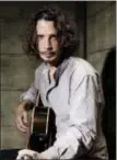  ?? INVISION — AP FILE ?? In this file photo, Chris Cornell plays guitar during a portrait session at The Paramount Ranch in Agoura Hills Cornell, 52, who gained fame as the lead singer of the bands Soundgarde­n and Audioslave, died at a hotel in Detroit.