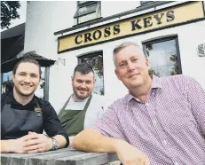  ??  ?? Chef Ben Davis with bar manager Liam Hopper and licensee Paul Hancock.