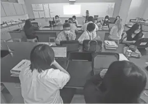  ?? ?? Biology teacher Abbie Baumann teaches in the new building of The Hmong American Peace Academy.