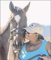  ?? Courtesy of Saratoga Warhorse ?? Veterans work with retired racehorses to overcome post-traumatic stress at Saratoga Warhorse. The three-day program is free for veterans.