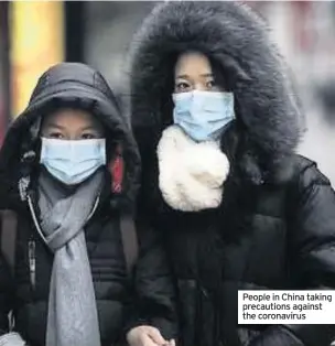  ??  ?? People in China taking precaution­s against the coronaviru­s