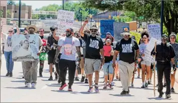  ?? Phil Masturzo / Associated Press ?? Protesters on Saturday march along South High Street in Akron, Ohio, calling for justice for Jayland Walker after he was fatally shot last week following a vehicle and foot pursuit.
