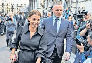  ?? ?? Rebekah Vardy poses for the paparazzi outside the High Court. Coleen and Wayne Rooney, left, leave the court vindicated
