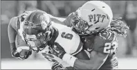  ?? Keith Srakocic/associated Press ?? Pitt defensive back Lafayette Pitts, right, tackles GardnerWeb­b running back Kenny Little Sept. 22 at Heinz Field.