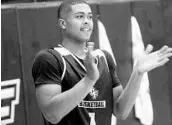  ?? CHRIS HAYS/STAFF ?? UCF point guard B.J. Taylor, a Boone High grad, reacts during the Knights’ first practice of the 2017-18 season.