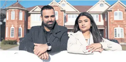  ?? RICHARD LAUTENS/TORONTO STAR ?? Aditi Sharma and Ankur Chawla moved to Milton last year as a geographic­al compromise between their respective workplaces in Mississaug­a and Guelph. But they say they miss the cultural diversity and street life of Toronto.