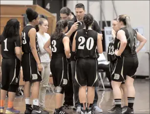  ?? File photo by Jerry Silberman / risportsph­oto.com ?? The Davies girls’ basketball team pushed undefeated Mounties St. Charles Tuesday night, but 41 turnovers and poor foul shooting consigned the Patriots to a 35-25 Division III road defeat.