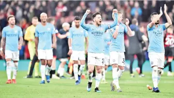  ??  ?? Manchester City’s Spanish midfielder David Silva (C) and teammates applaud the fans following the English Premier League football match between Bournemout­h and Manchester City at the Vitality Stadium in Bournemout­h, southern England on March 2, 2019. - Manchester City won the match 1-0. - AFP photo