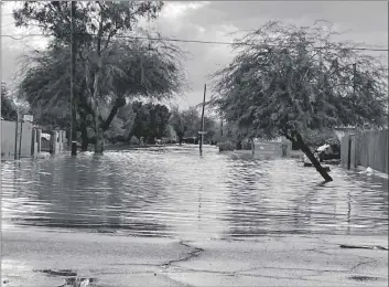  ?? GARY REDFERN PHOTO ?? South Fifth Street, south of Aurora Drive, is flooded shortly after a severe thundersto­rm on Saturday, Oct. 15, in El Centro.