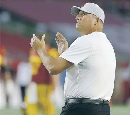  ?? Luis Sinco Los Angeles Times ?? USC FOOTBALL coach Clay Helton f ired two assistants earlier this month, marking the third straight January of staff upheaval.