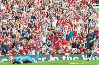  ?? BEN STANSALL AFP/GETTY IMAGES ?? Mohamed Salah capped Liverpool’s 3-1 win over Arsenal on Saturday with one of the best goals of the young season.