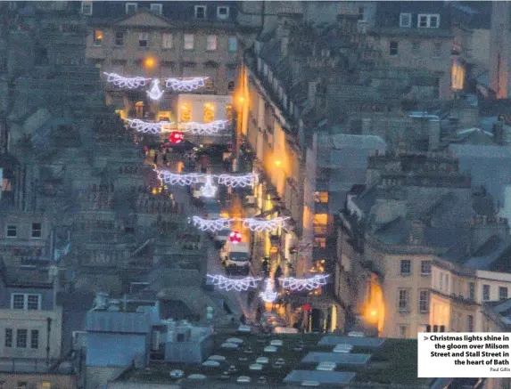  ?? Paul Gillis ?? Christmas lights shine inthe gloom over Milsom Street and Stall Street inthe heart of Bath