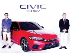  ?? ?? (From left) Honda Malaysia president and chief operating officer Sarly Adle Sarkum and Yoshimura at the launch of The Civic e:HEV RS