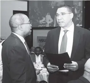  ?? FILE ?? Prime Minister Andrew Holness (right) in discussion with the Reverend Stevenson Samuels at the 37th National Leadership Prayer Breakfast on January 2017.