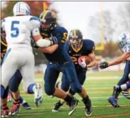  ?? NATE HECKENBERG­ER — FOR DIGITAL FIRST MEDIA ?? Richie Sampson was one of the few workhorse running backs for Unionville, who has relied on mobile quarterbac­ks to add to the running game.