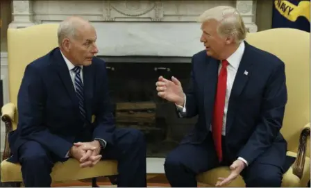  ?? ASSOCIATED PRESS FILE ?? President Donald Trump talks with new White House Chief of Staff John Kelly after he was privately sworn in during a ceremony in the Oval Office in Washington. For an administra­tion that has spent 2017 throwing off headlines at a stunningly dizzying...