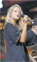  ?? TODD OLSZEWSKI/BALTIMORE ORIOLES ?? Carter Faith performed again at Camden Yards after the Orioles’ game Friday. She sang there last year. Her performanc­e is part of the Orioles’ “Friday Fireworks & Music” concert series, which continues through Aug. 23.