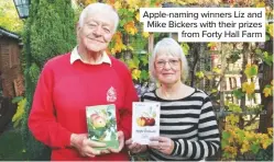  ??  ?? Apple-naming winners Liz and Mike Bickers with their prizes from Forty Hall Farm